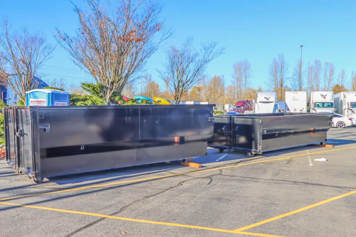 Professional dumpster rental service with roll-off container on residential driveway in Silverthorne